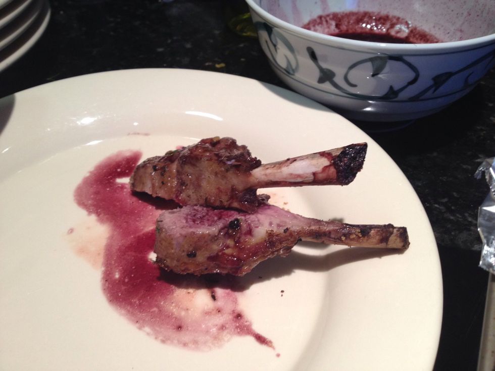 Pour wine sauce over lamb.