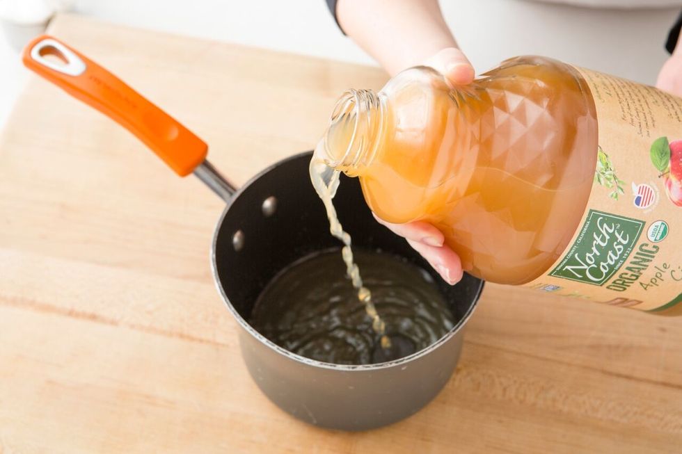Pour your 2 cups of apple cider into a medium sauce pan.
