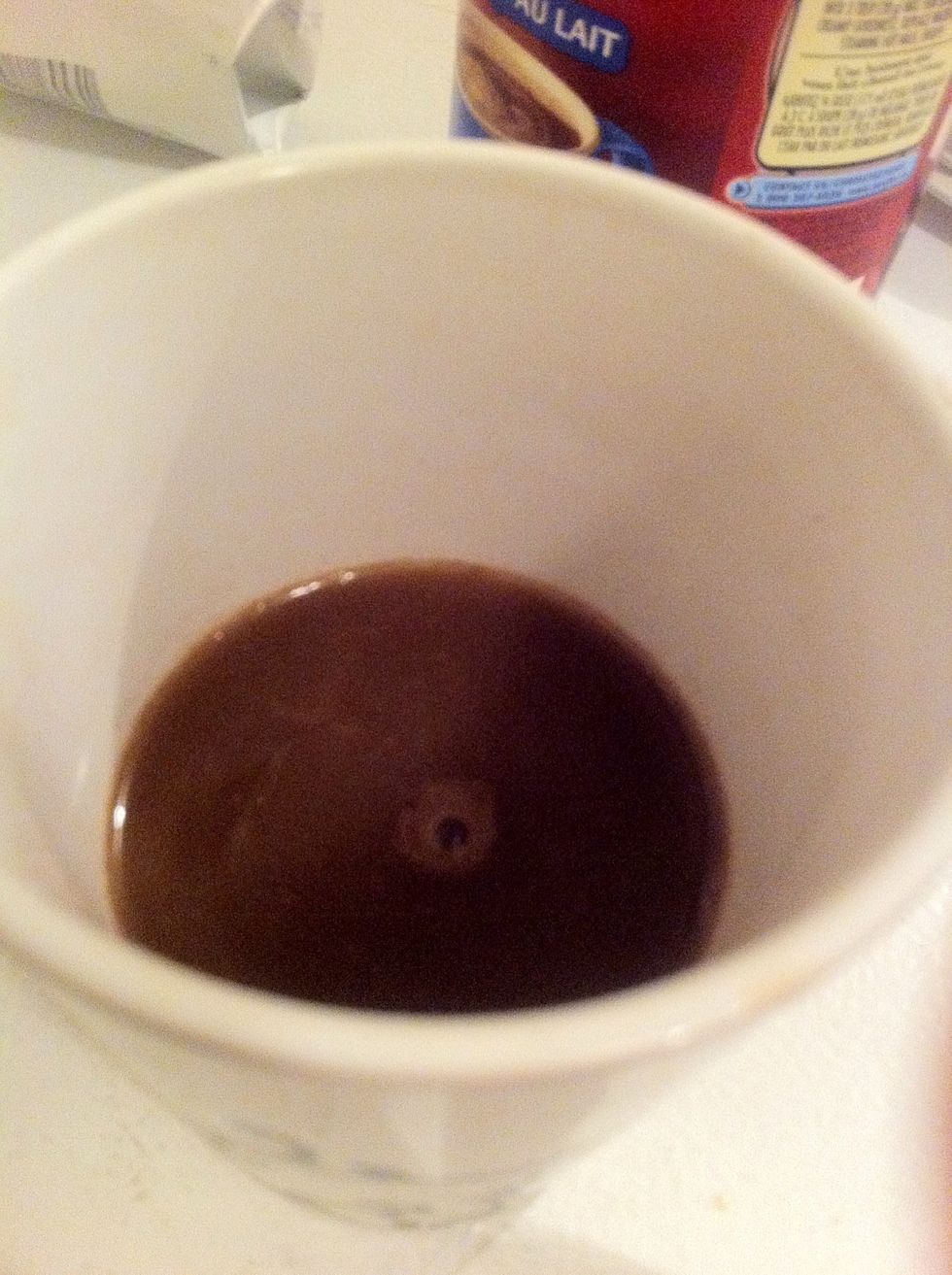 Pour your coffee in the cup until half full