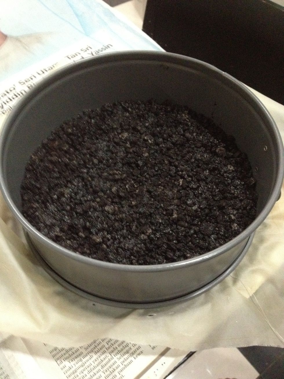 Pour your cookie crumbs into your baking dish to form the crust. Even it out.