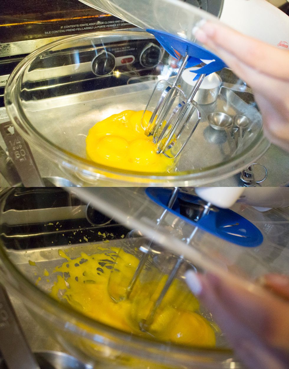 Pour your egg yolks into a large bowl, and beat until thick.