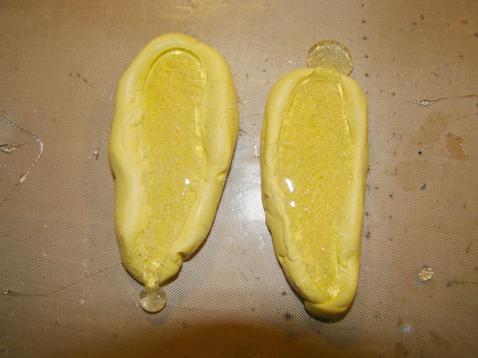 Pour your hot UTEE into the molds. Do not worry if it runs over a bit. Once dry you can cut the excess off and put it back in your heating pot to melt for future use.