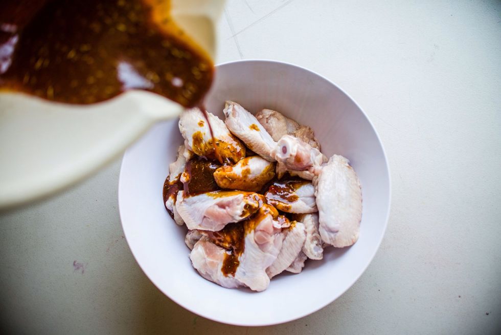 Pour your ingredients into your raw chicken. You can use gloves or your bare hands, mix the sauce into the chicken for balanced flavor. I let my meat marinate for hours, up to 2 days. Better flavor!!!