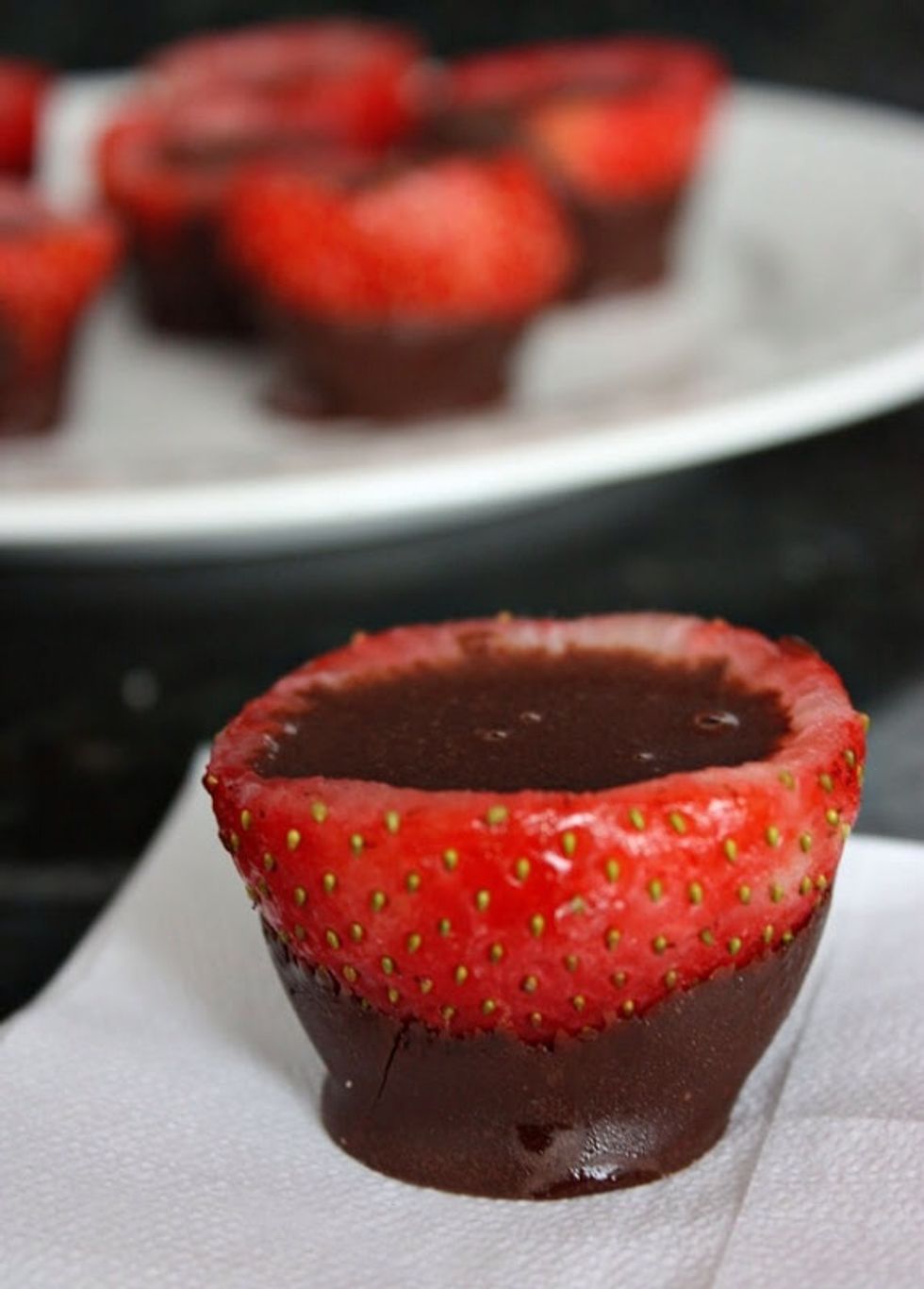 Pour your mix of godiva, vodka and chocolate syrup into the strawberries! This is what they should look like after you're done! SHOOT-EAT! Enjoy!