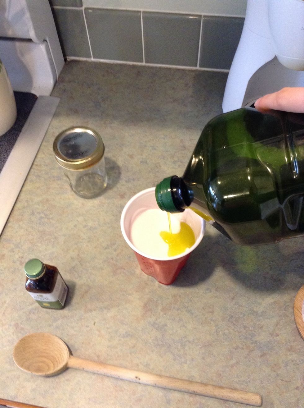 Pour your olive oil into the sugar.