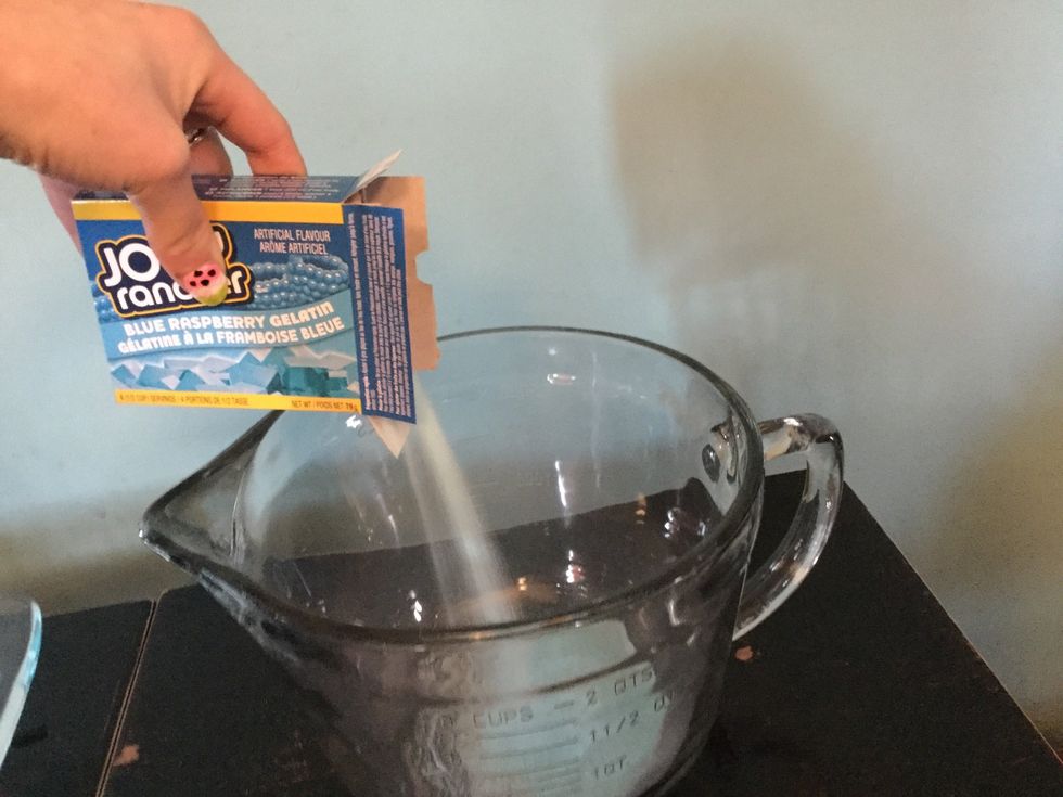 Pour your packs of jello into your large measuring cup