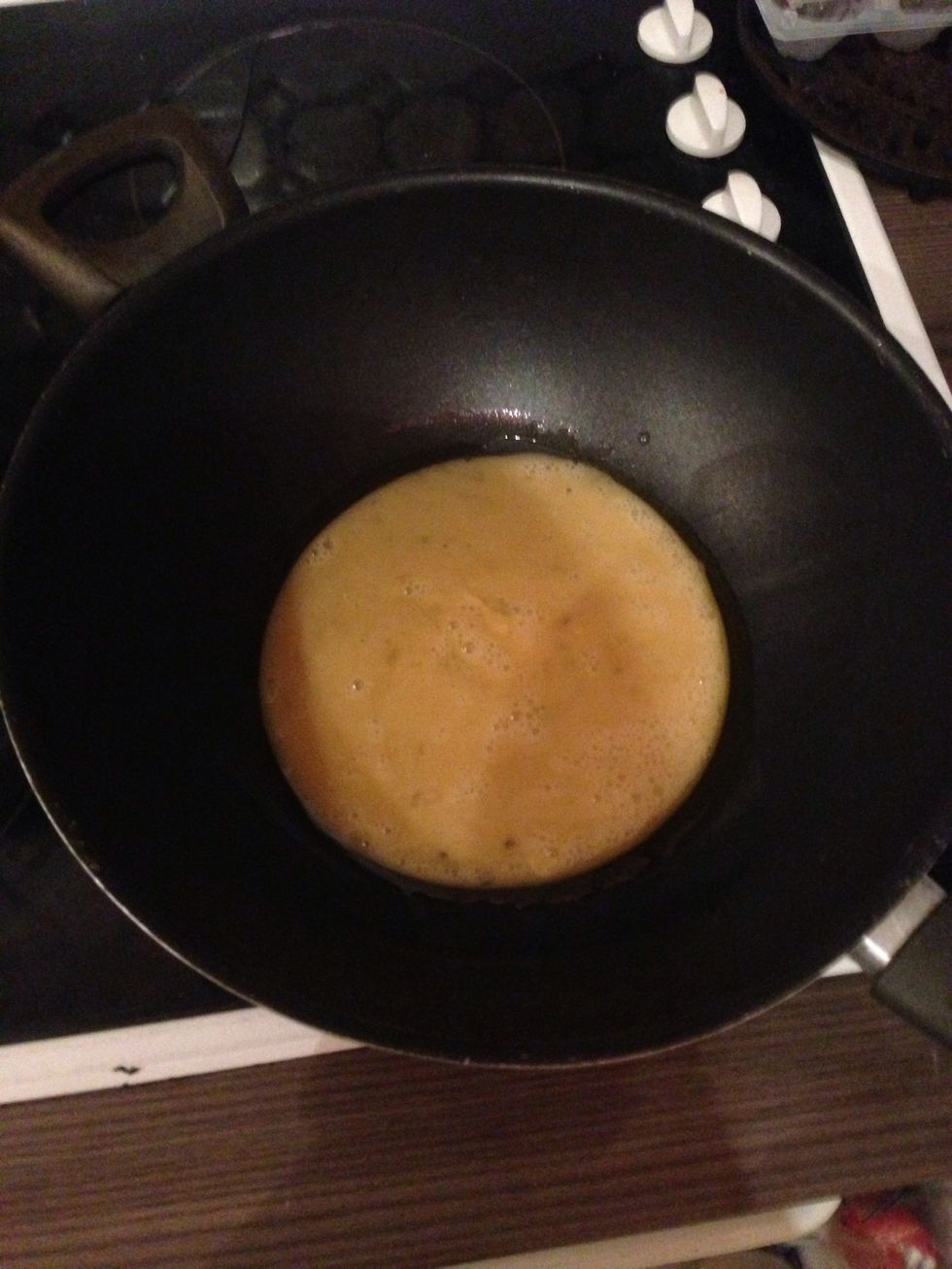 Pour your whisked egg into the pan once the oil is hot.\ud83c\udf73