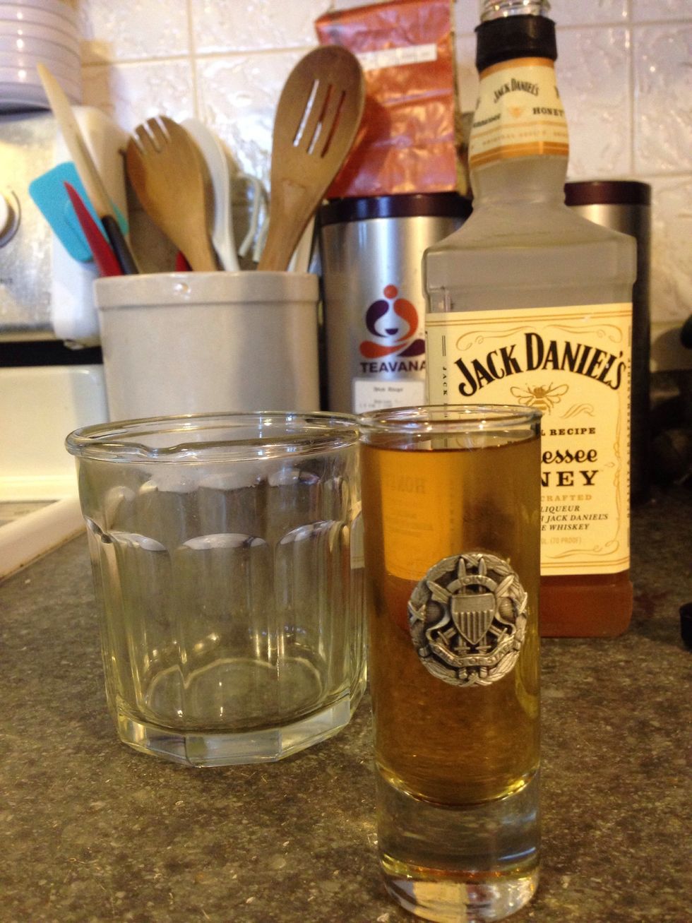 Pour yourself a glass of wine, like we recommend before any good Kitchen adventure, take a few sips and a few deep breaths...here we go. Fill the shot glass with the Jack Daniels Honey Liqueur.