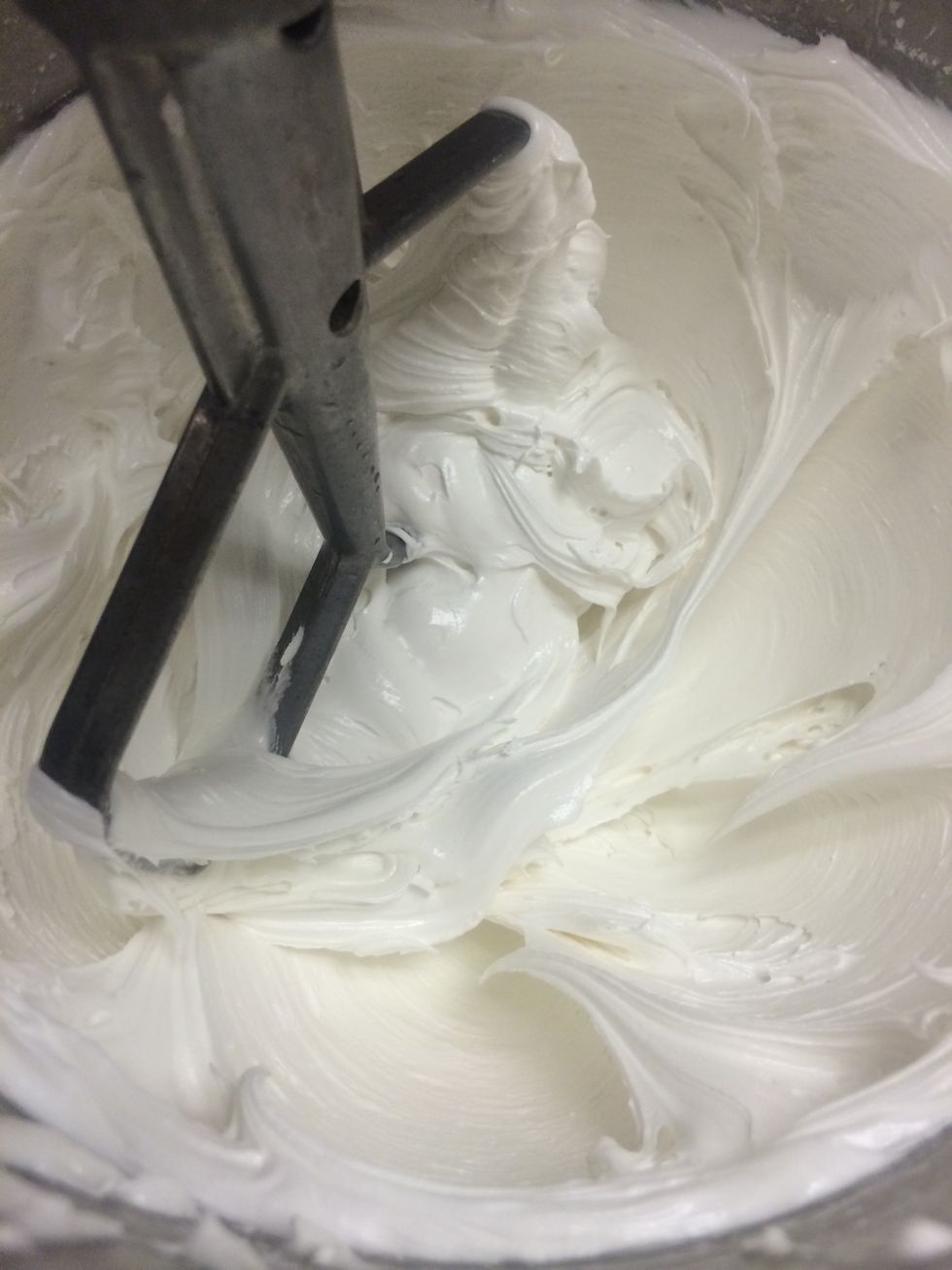 Powdered sugar is added and whipped with a paddle until thick and firm and the consistency of butter cream frosting. Whip for about 5 minutes.