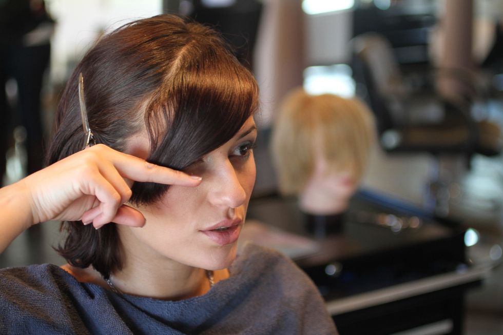 Practice holding your bangs at the length you want them to be \u2014 when you like what you see, take note of the length of hair hanging below your fingertips; that is how much you want to chop off.