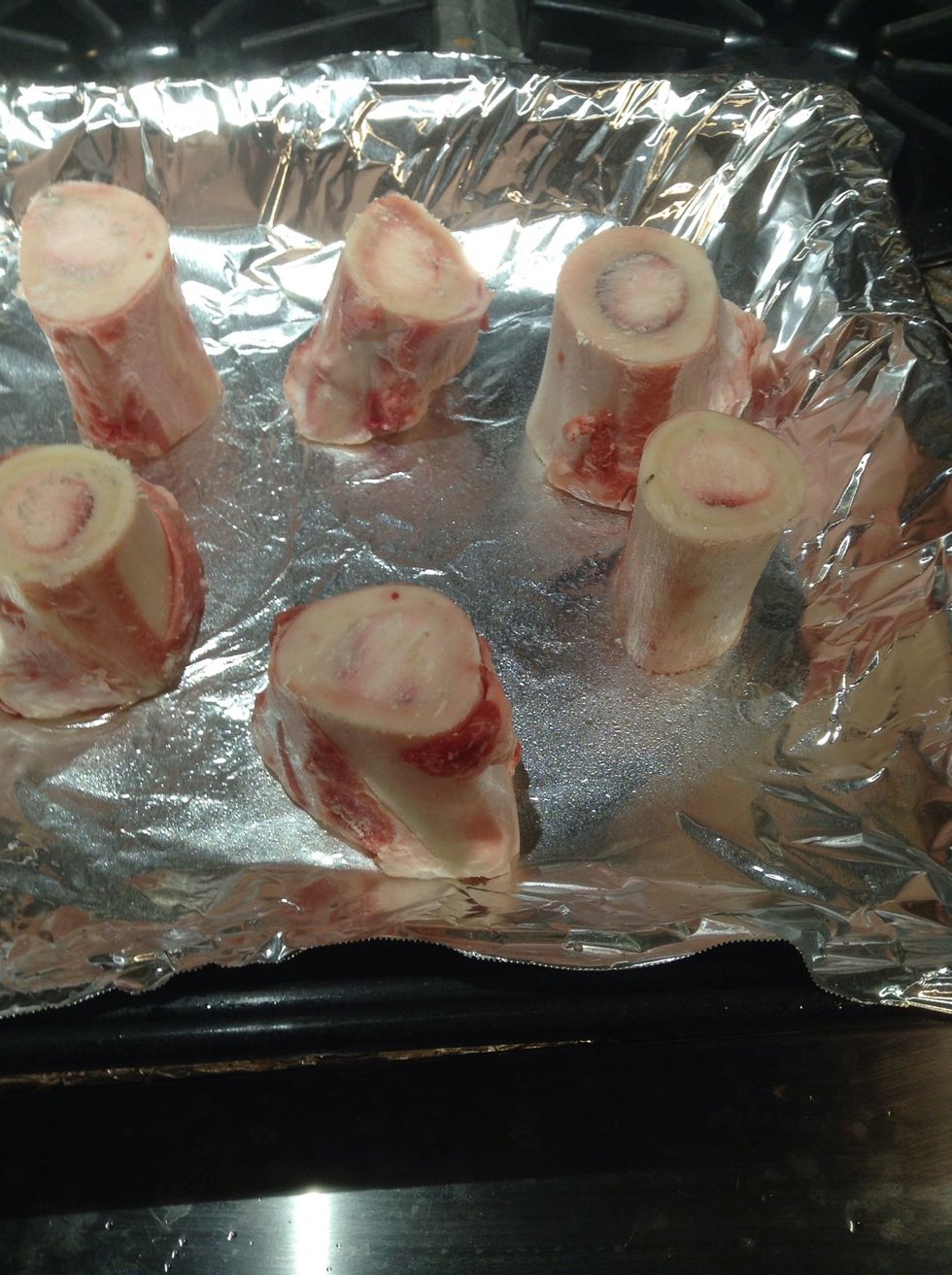 Pre-heat to 450F or 232C arrange marrow bones on foil lined pan and bake 15 min. When done immediately turn oven down to 375F or 190C. Remove when done and set aside.