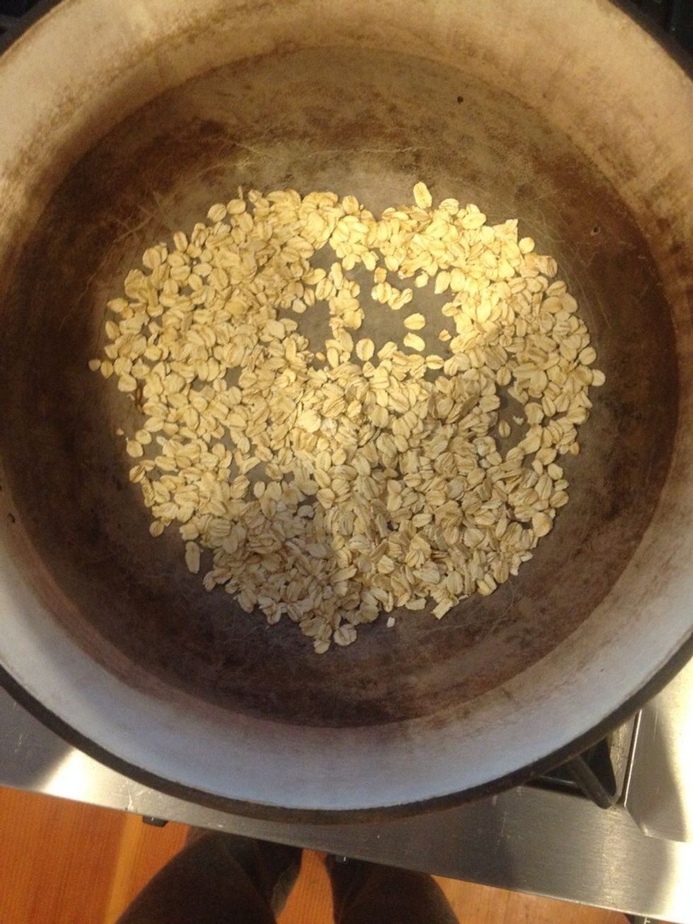 Pre heat your Dutch oven for 15 min in the oven at 450 degrees Fahrenheit. Then pull it out, and cover the bottom with steel cut oats.