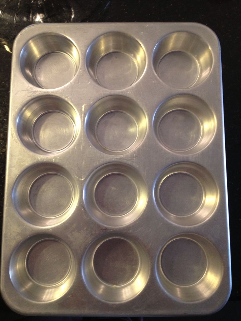 Pre-heat your oven to 350 degrees. Then Get your cupcake pan out and spray with Pam