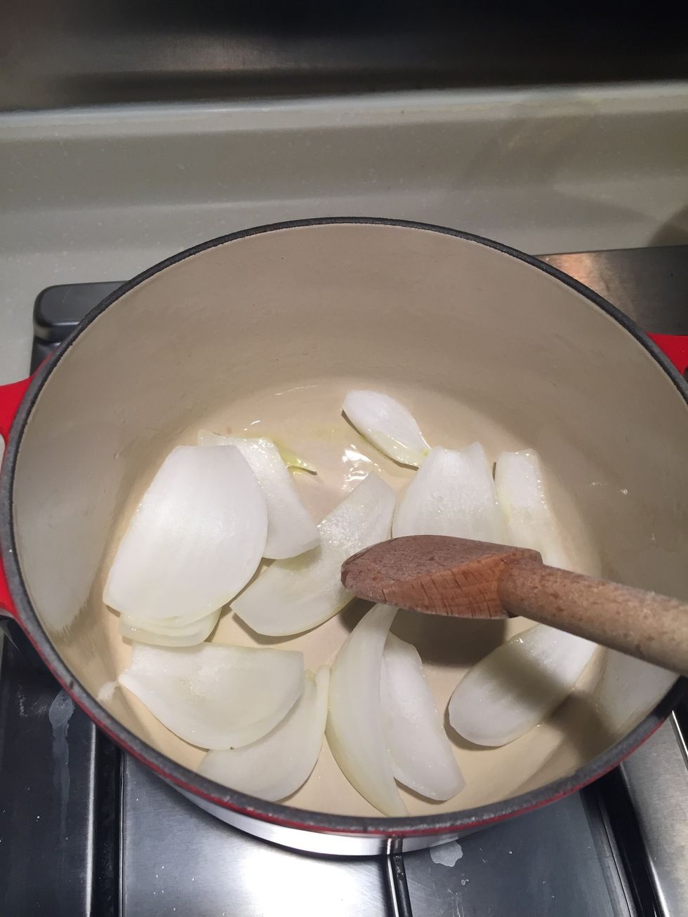 Preheat a deep pan.  Add the olive oil and cook the onions.