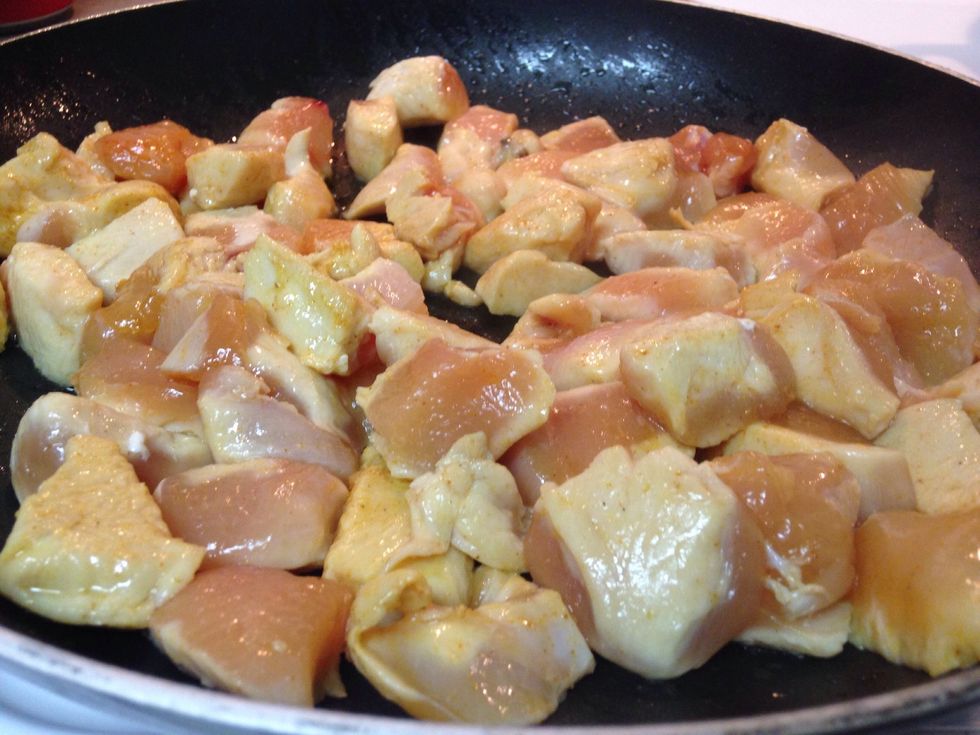 Preheat a large saut\u00e9e pan over medium heat, with clarified butter. When butter starts to shimmer, place the chicken in the pan. Cook till chicken is done.