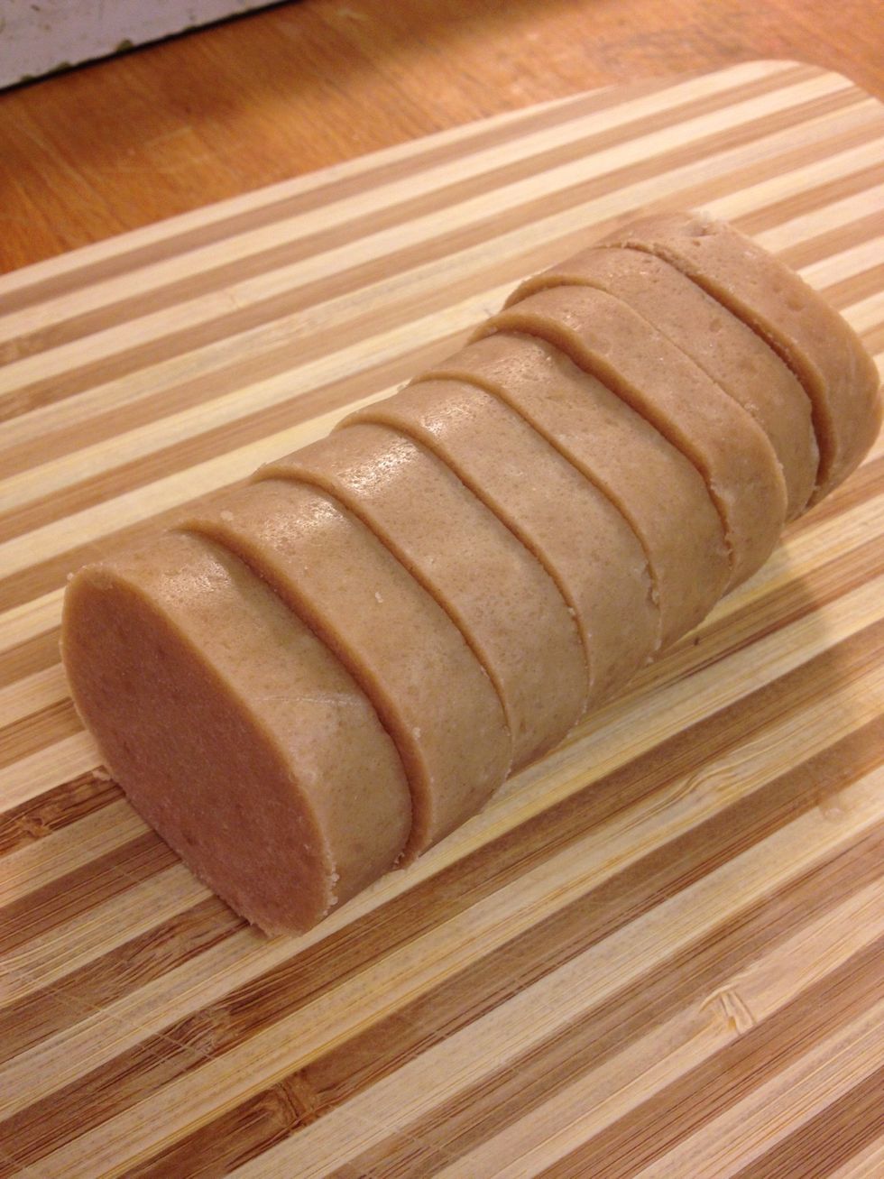 Preheat oven according to package instructions, usually 350F.  Remove wrapping from refrigerated dough.  Cut each roll into 12 pieces of 1/2 inch slices.