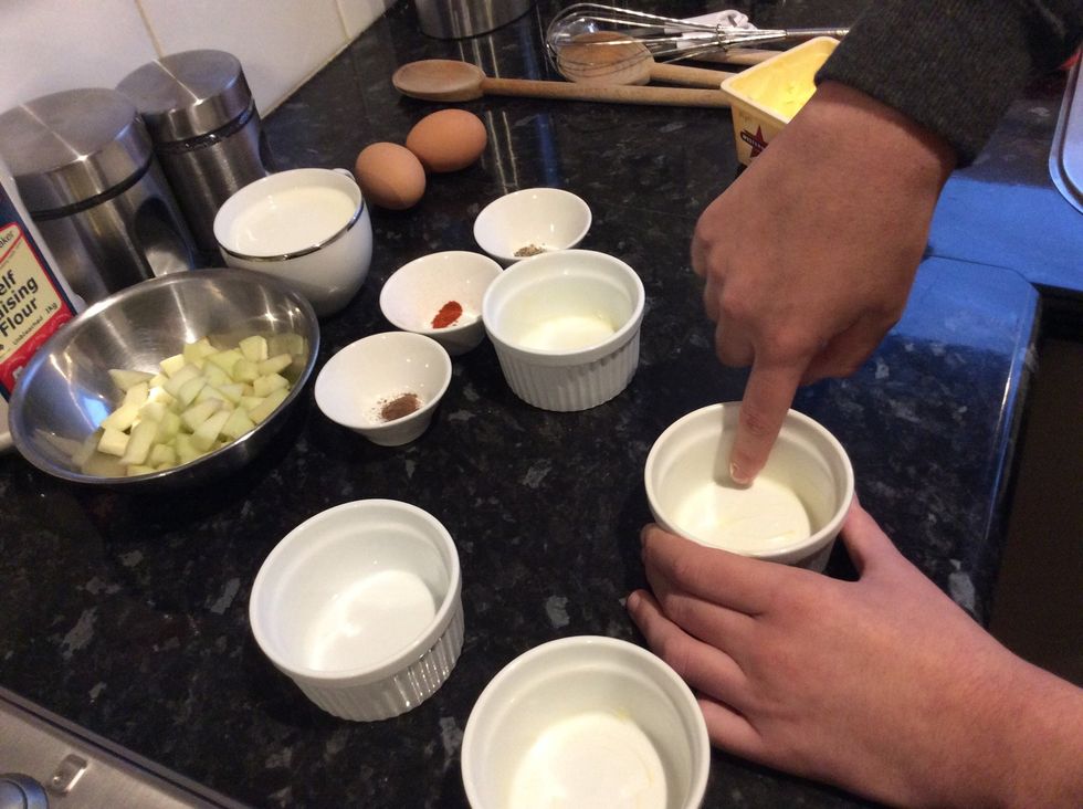 Preheat oven to 200 degrees and lightly butter ramekins.