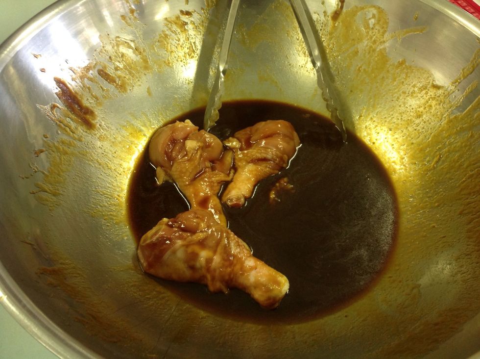 Preheat oven to 200 degrees Celsius . Make 5cm slits in the skin of the drum-sticks. Mix the hoisin sauce, golden syrup and oil together and marinate the chicken in it by refrigerating for 15 minutes.