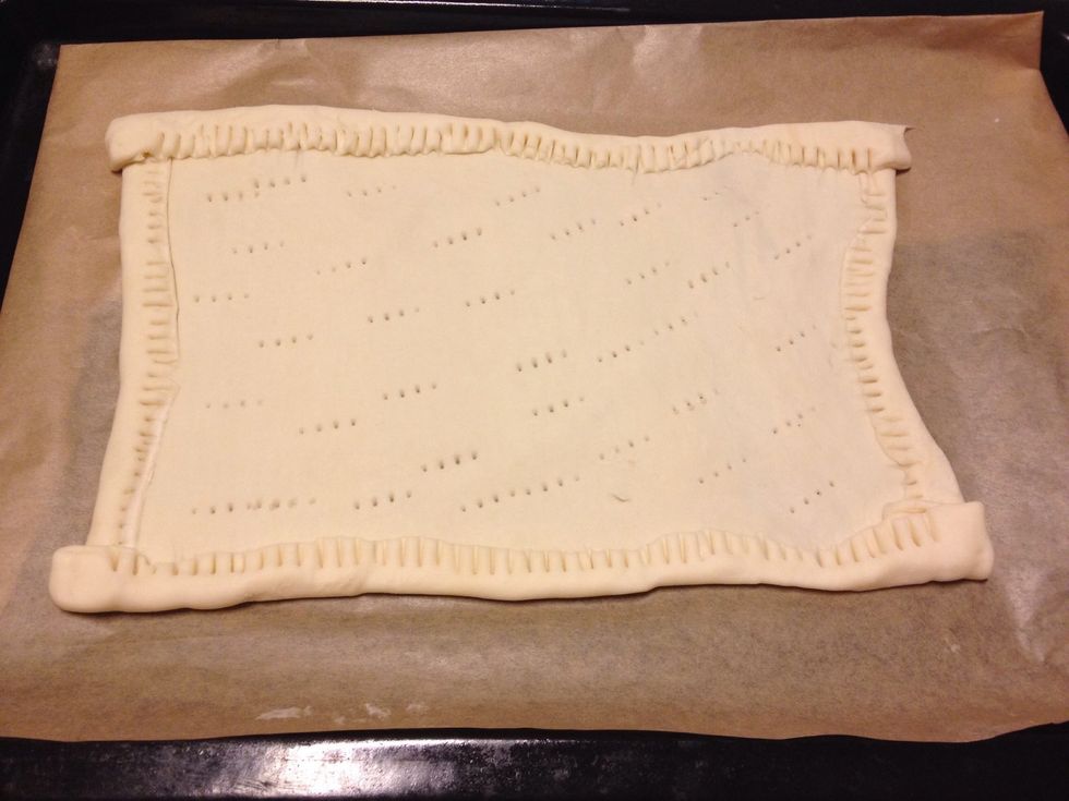 Preheat oven to 220\u00b0C. Place pastry on an oiled oven tray. Fold edges of pastry over to make a border all the way around pastry. Prick pastry base with fork. Bake for 10 minutes.