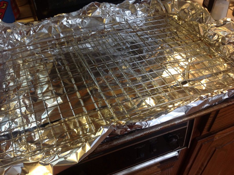 Preheat oven to 250 degrees. Line a pan with tinfoil and set roasting rack inside. I don't have a roasting rack so I doubled up some cookie cooling racks.