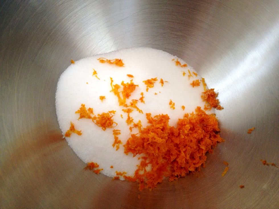 Preheat oven to 300 degrees Fahrenheit. In a large mixing bowl, add the sugar and orange zest. Use a spatula or your fingertips and rub the zest into the sugar to make the sugar fragrant.