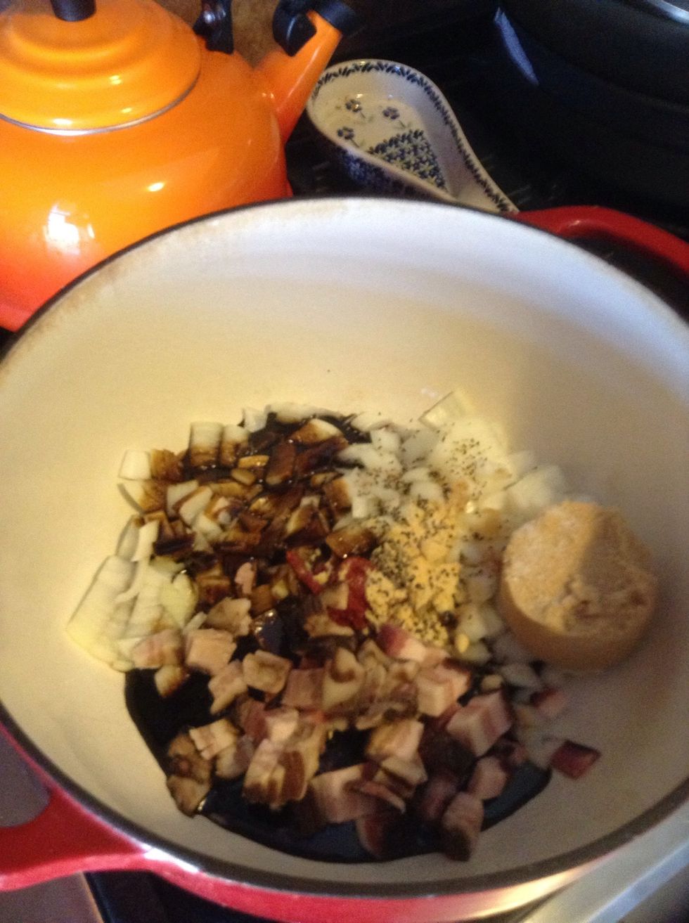 Preheat oven to 300 F. Dice onion and bacon, and place in large Dutch oven along with brown sugar, molasses, tomato paste, mustard, salt and pepper.