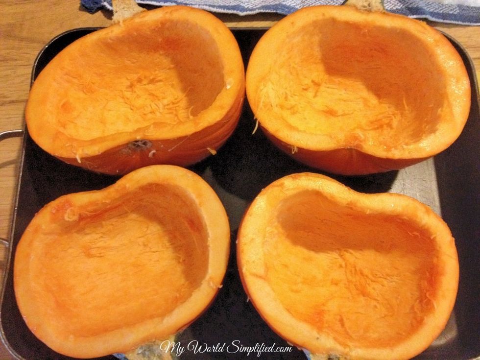 Preheat oven to 325. Cut the pumpkins in half and scoop out all the stringy stuff and the seeds. Place the pumpkins in a casserole dish skin side down, fill about half full of water.