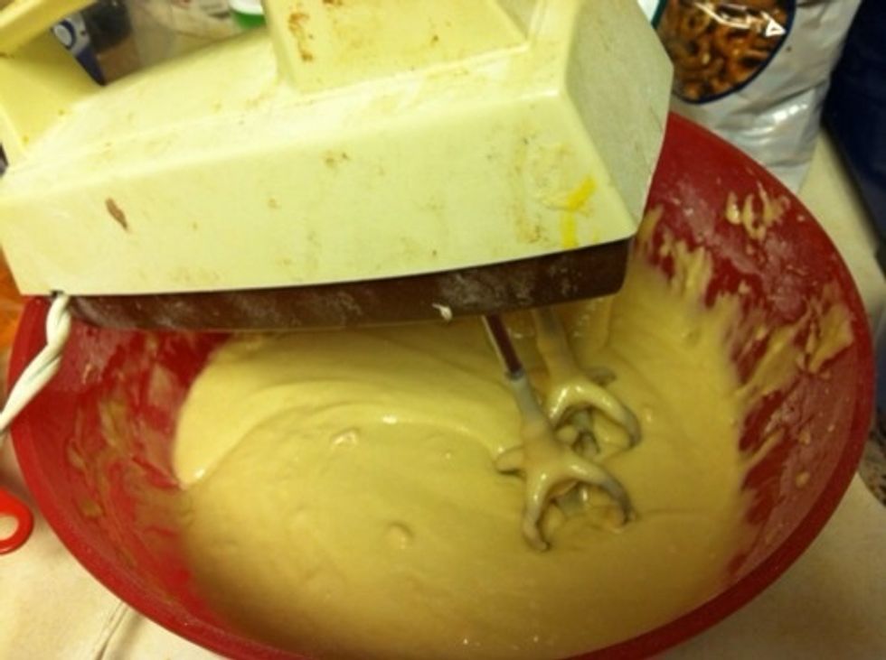 Preheat oven to 350 degrees F. Mix 3 cups flour, 1/4 tsp salt, 1 cup sugar, baking powder, 1.5 cups milk, eggs, and 2 tsps vanilla. Slowly add 1/2 cup melted butter. Batter will be thick.