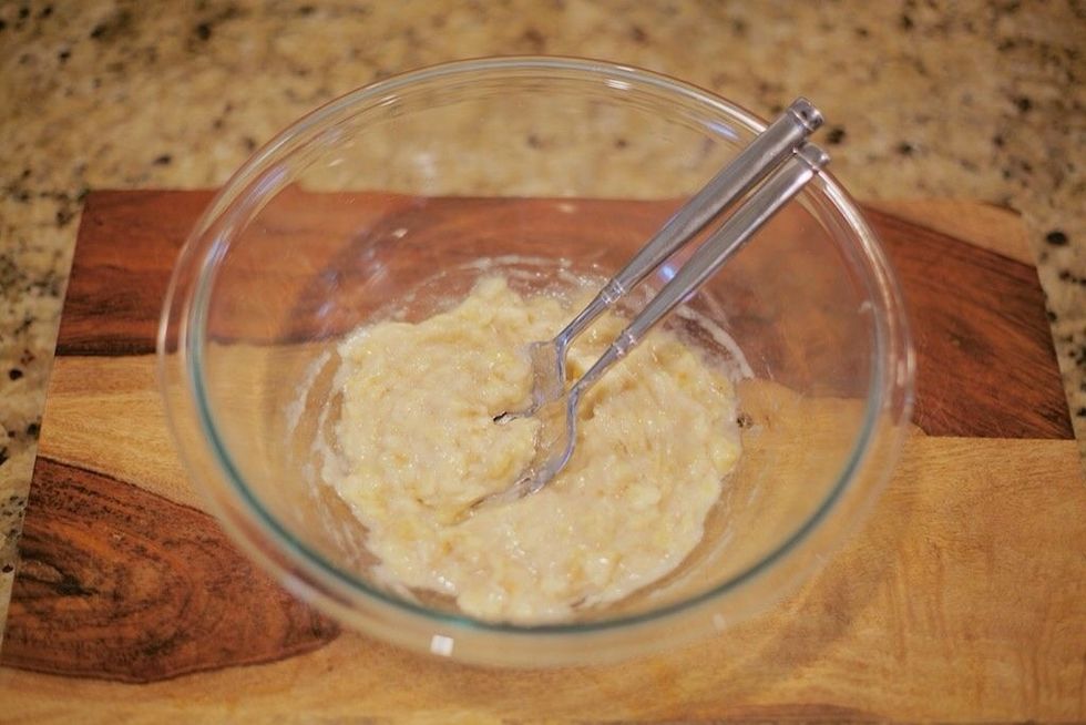 Preheat oven to 350 degrees. Mash the chopped bananas with a fork or pastry knife until there are few to no bumps