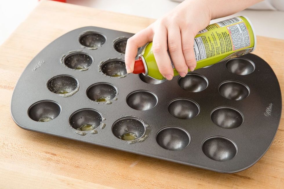 Preheat oven to 350 degrees. Spray your donut hole pan with cooking spray and set aside.