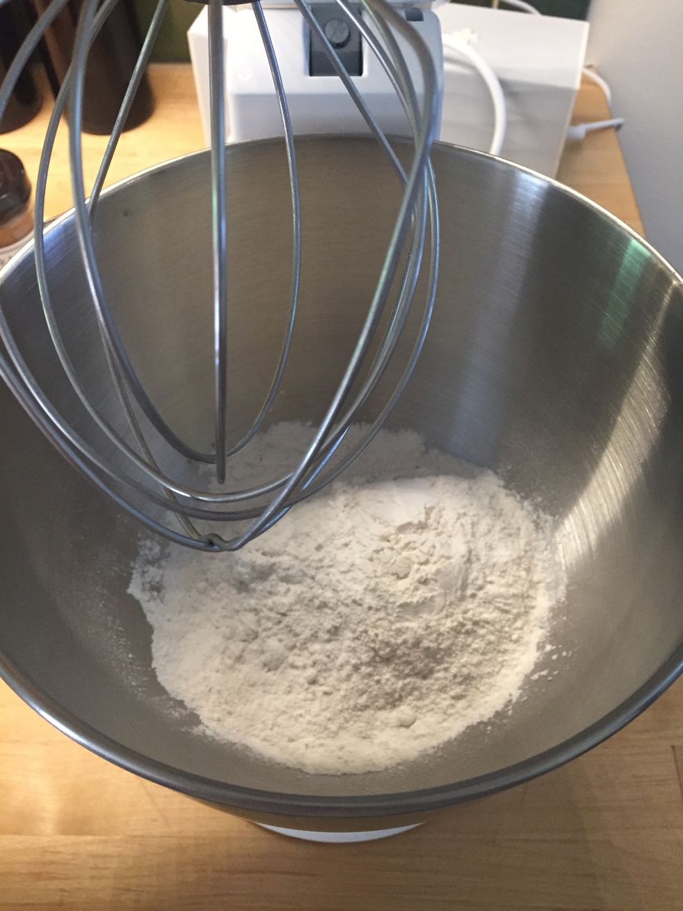 Preheat oven to 350 degrees. Then, add flour to a mixer or large bowl.