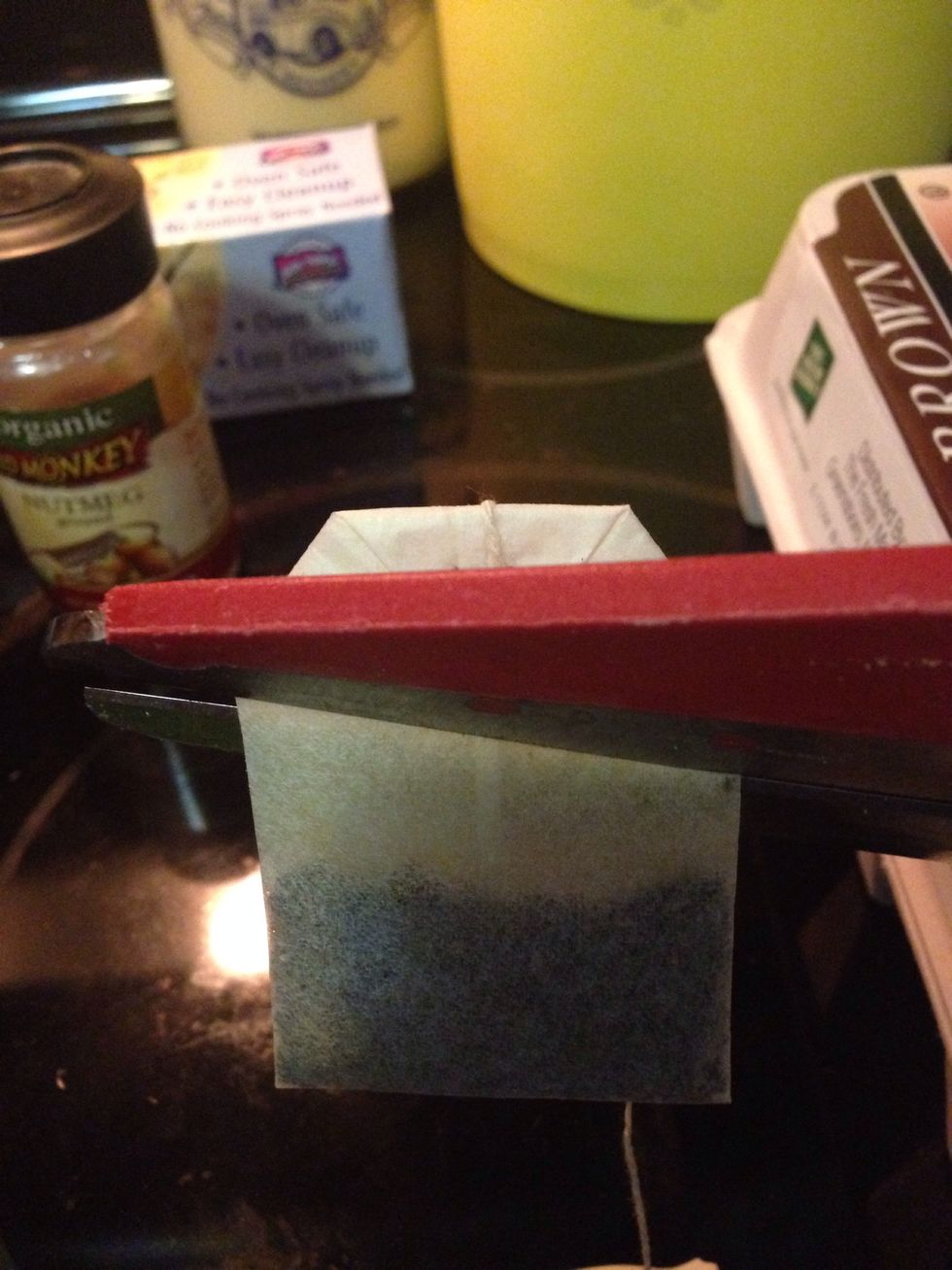 Preheat oven to 350.  Open tea bag and directly pour contents into the sugar cookie mix, along with melted butter, egg and 2 tbsps eggnog. Mix well.