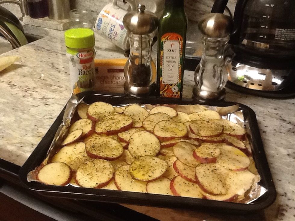 Preheat oven to 350. Slice and layer potatoes, sprinkle with coarse ground pepper, salt and extra virgin olive oil, add other herbs or seasonings to taste.