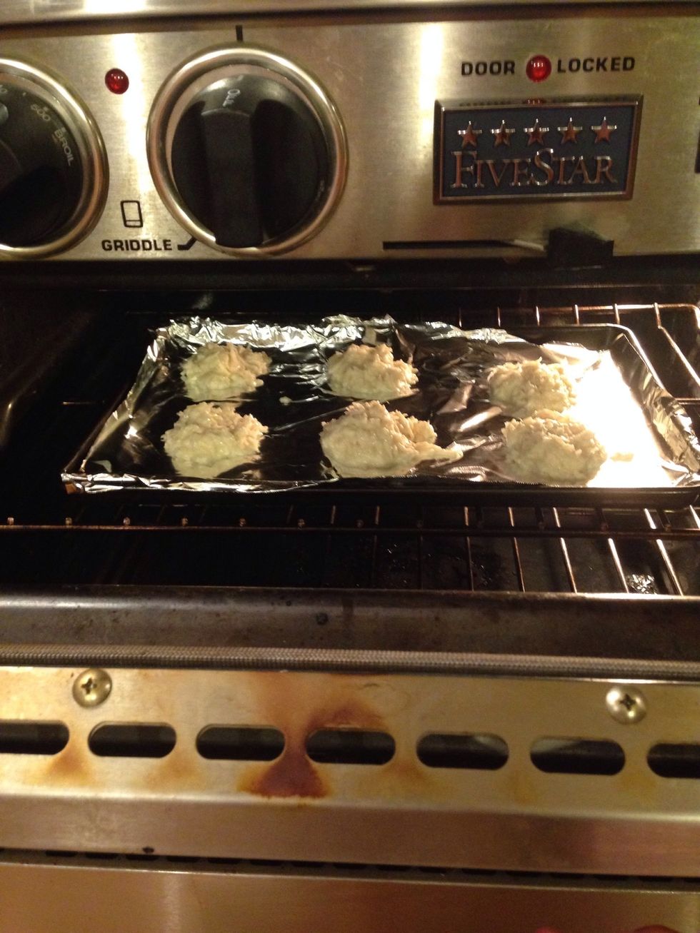 Preheat oven to 350\u00b0 F then put macaroons in over until coconut turns a light brown on the sides (13-15 minutes)