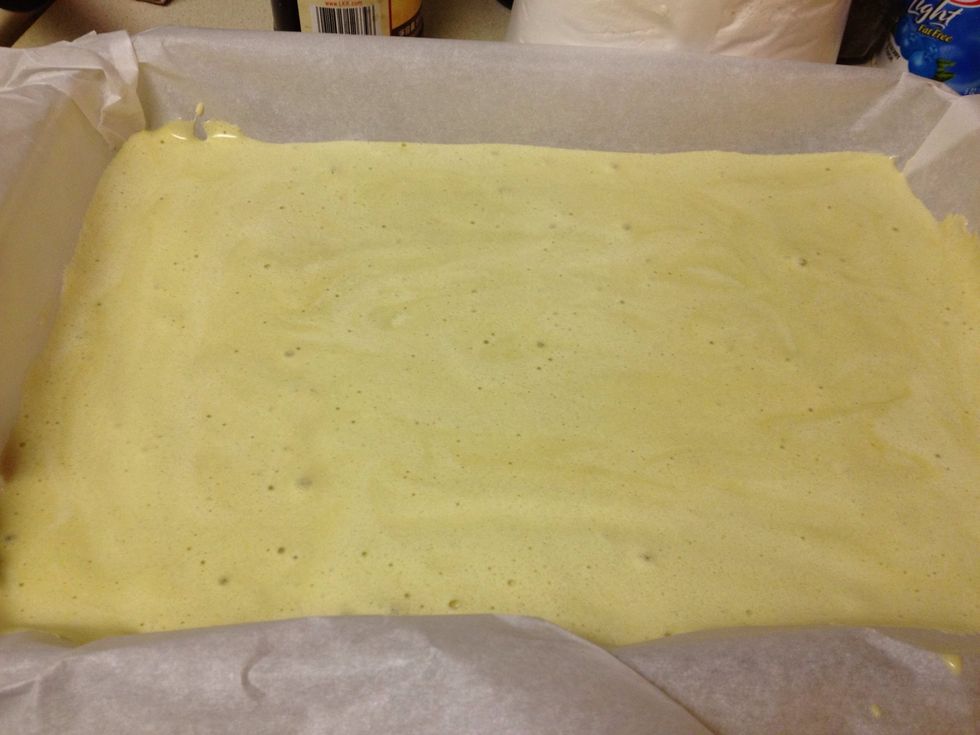 Preheat oven to 350F degrees. Cover the bottom of a standard jellyroll pan with waxed paper. Pour cake batter into pan and spread it out to cover the entire bottom in a thin but even layer of cake.