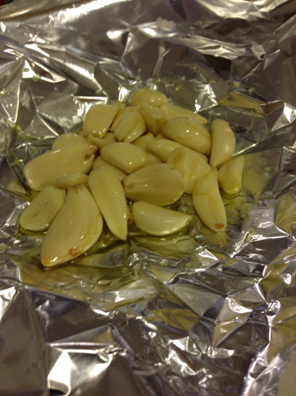 Preheat oven to 375 degrees F. Peel the garlic and put it in the aluminum foil with oil and salt