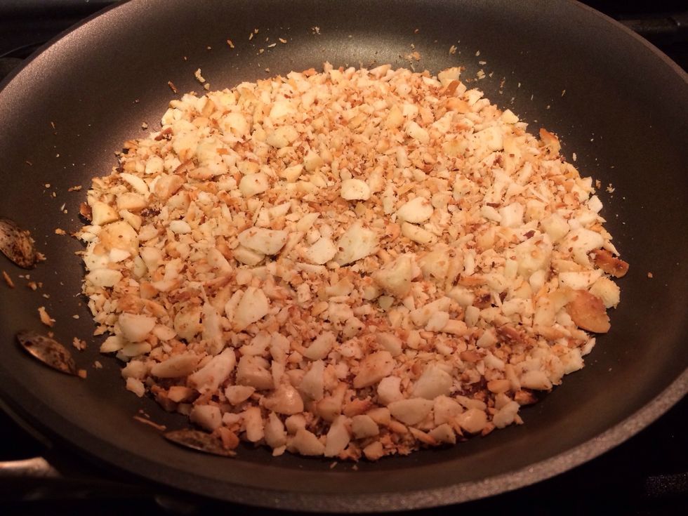 Preheat oven to 375 degrees. Toast macadamia nuts over low heat