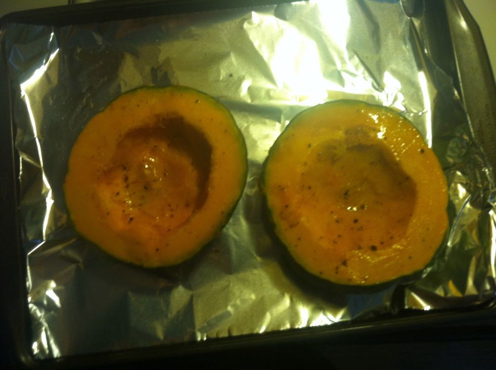 Preheat oven to 375. Foil line pan. Cut squash in half rub with olive oil salt and pepper.