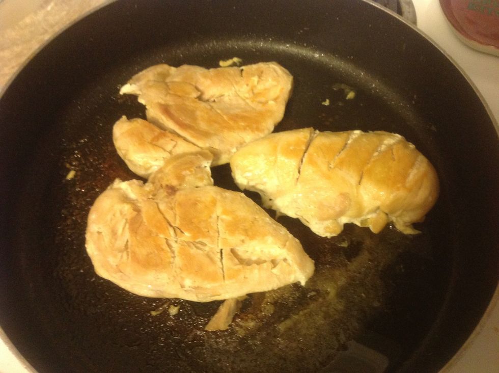 Preheat oven to 400 degrees. Cook chicken breasts on stovetop in skillet. (If you are in a hurry, you could use rotisserie chicken from a deli).