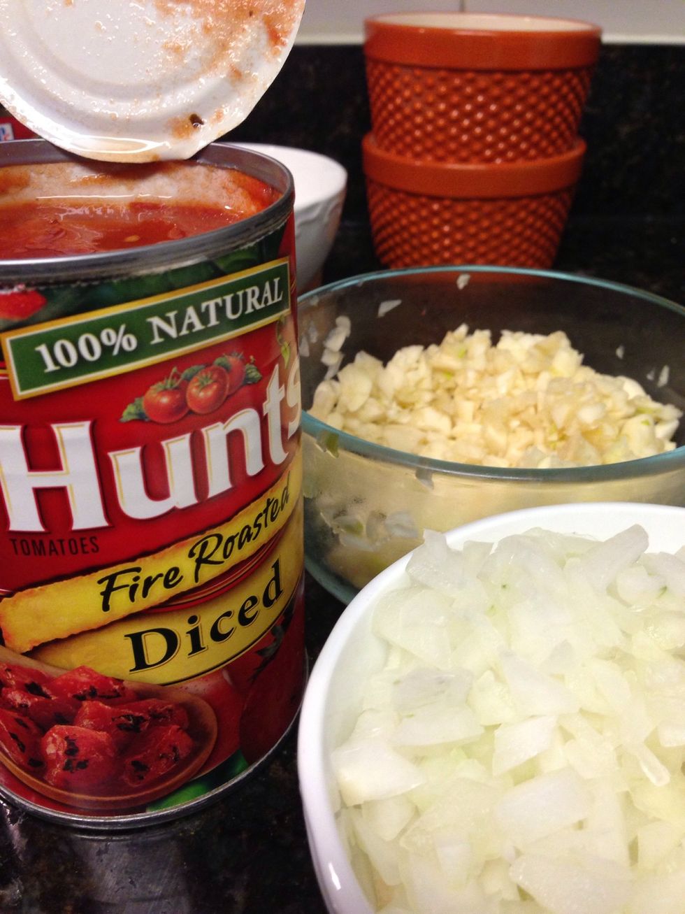 Preheat oven to 400 degrees. Heat pan on medium heat with 1 tbsp of olive oil. Once oil is hot, add onions and garlic. Cook for 2-3 minutes, or until onion is translucent.