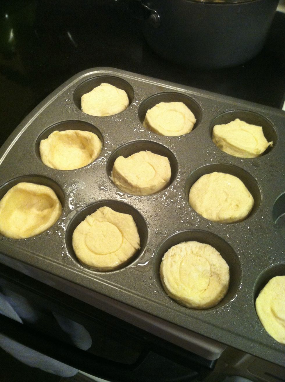 *Preheat oven to 400F.  I oiled a muffin pan and put the biscuits in the cups.