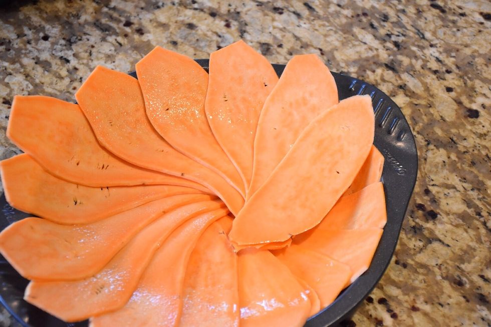 Preheat oven to 400F. Meanwhile, lay sweet potato slices in a shallow baking dish.  I used a mandolin.  Fan slices to cover the bottom and sides.  Spray with cooking spray. Place in oven for 20min.