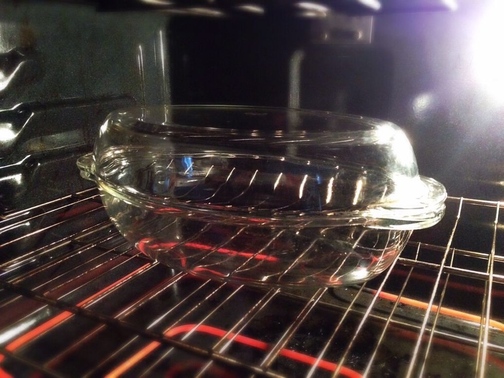 Preheat oven to 420F (215C) with your dish of choice (I use a glass oval dish with a lid). It will be hot enough by the time the dough rises.