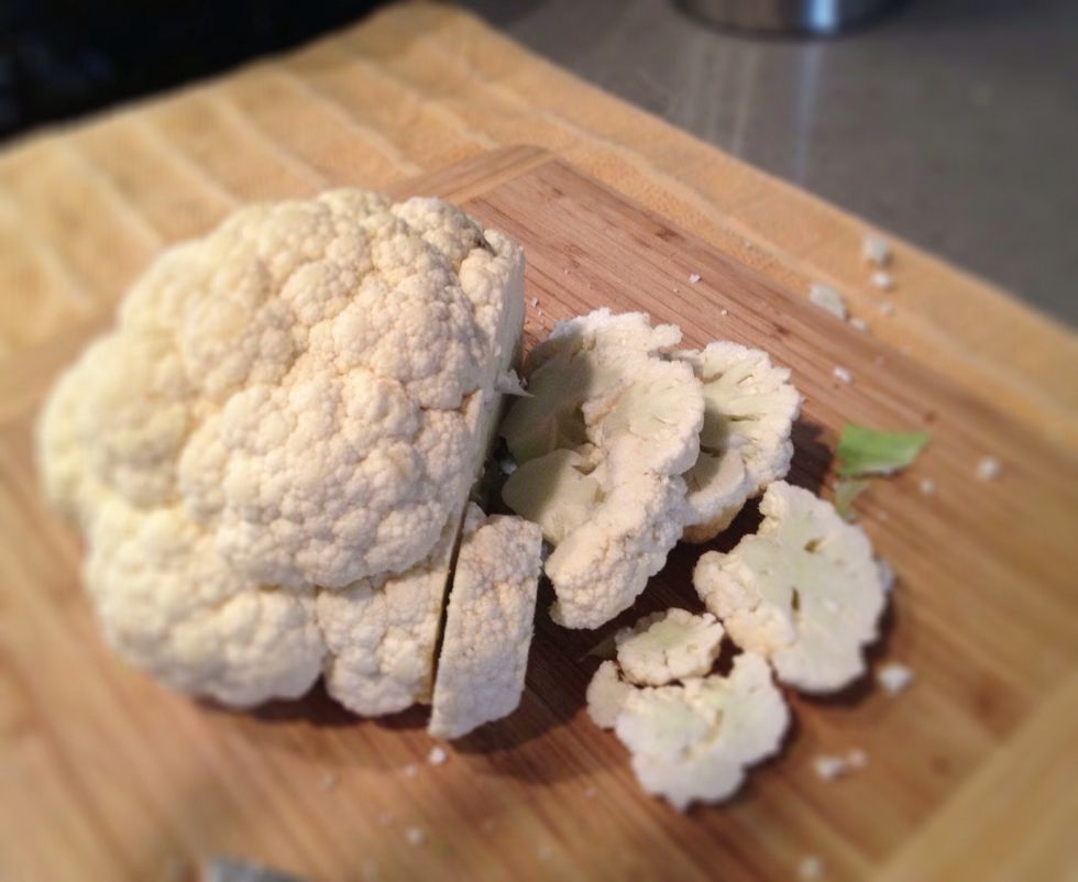 Preheat oven to 425 degrees. If you buy the cauliflower whole, remove the bottom leaves and slice it. You could very easily use a bags of fresh cauliflower florets too.