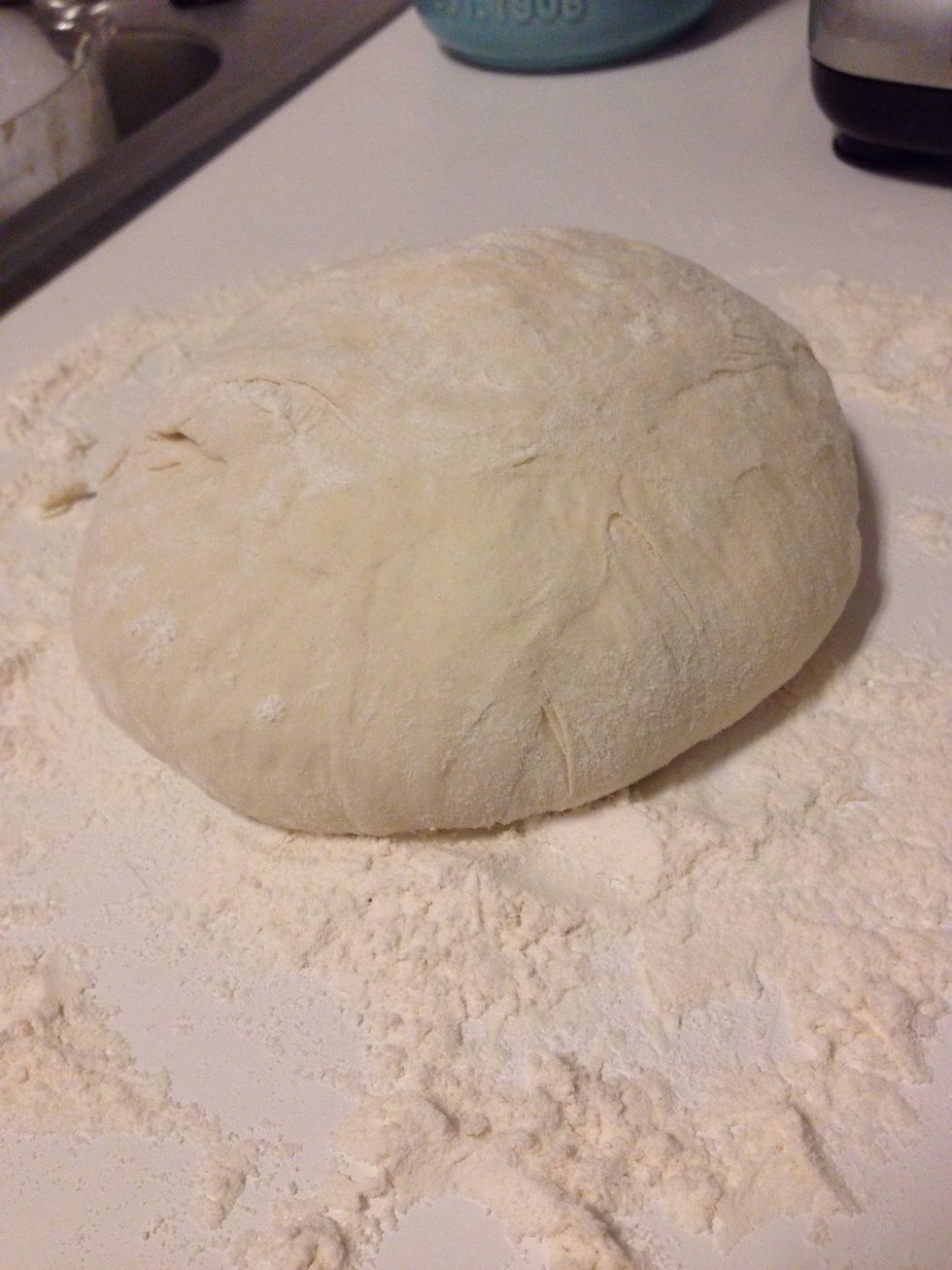 Preheat oven to 450*. Once heated, put your Dutch oven inside so that it can also preheat to 450* (15 minutes). While heating, heavily flour your work surface and knead your dough into a ball.