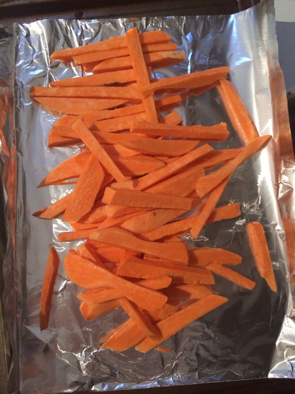 Preheat oven to 450. Skin and slice ~3 sweet potatoes into long, thin pieces. Place onto baking tray.