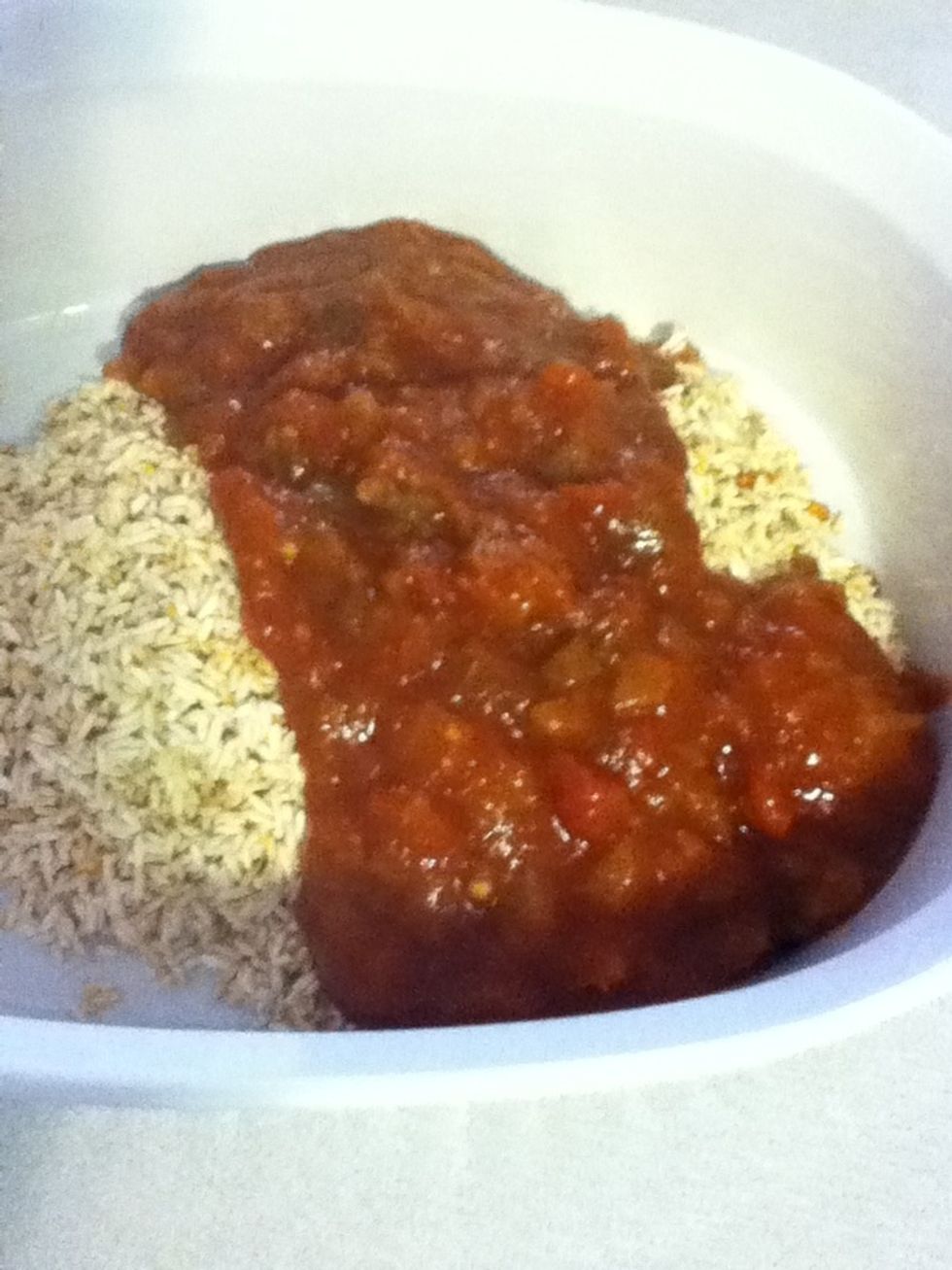 Preheat the oven to 350, put the rice in a casserole dish and add about a cup and a quarter of any old salsa. You can use the dregs of open bottles you have in your fridge, and it'll still be good.