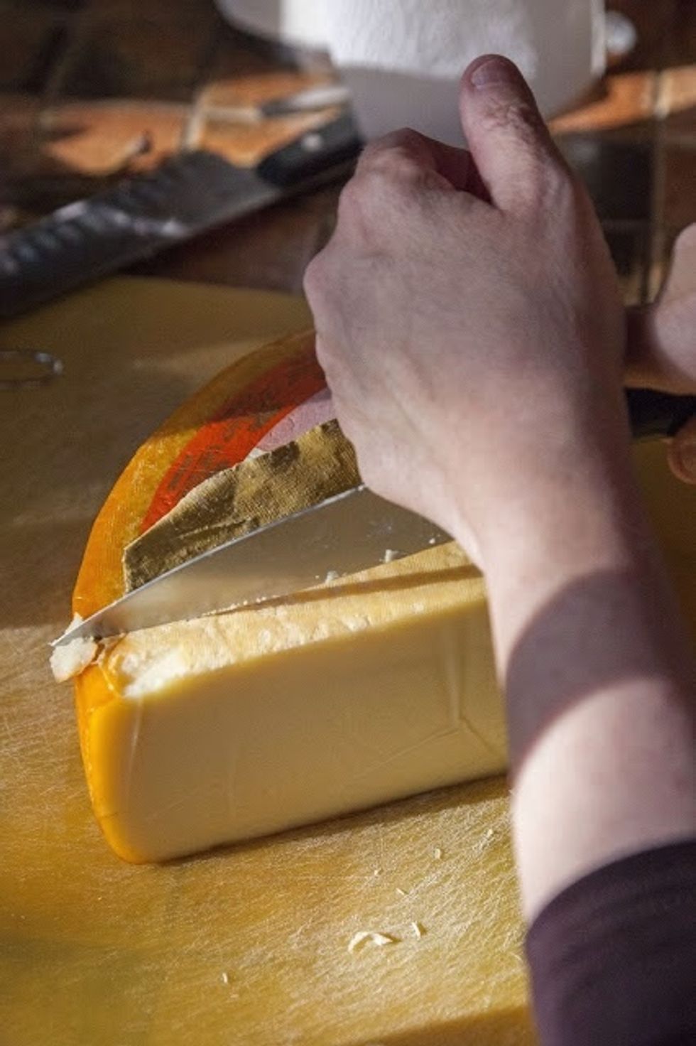 Preheat the oven to 400 degrees. Lightly grease the inside of a 2 quart baking dish and set it aside. Slice the cheese. If you can, use the best cheese (cheeses) you can get.