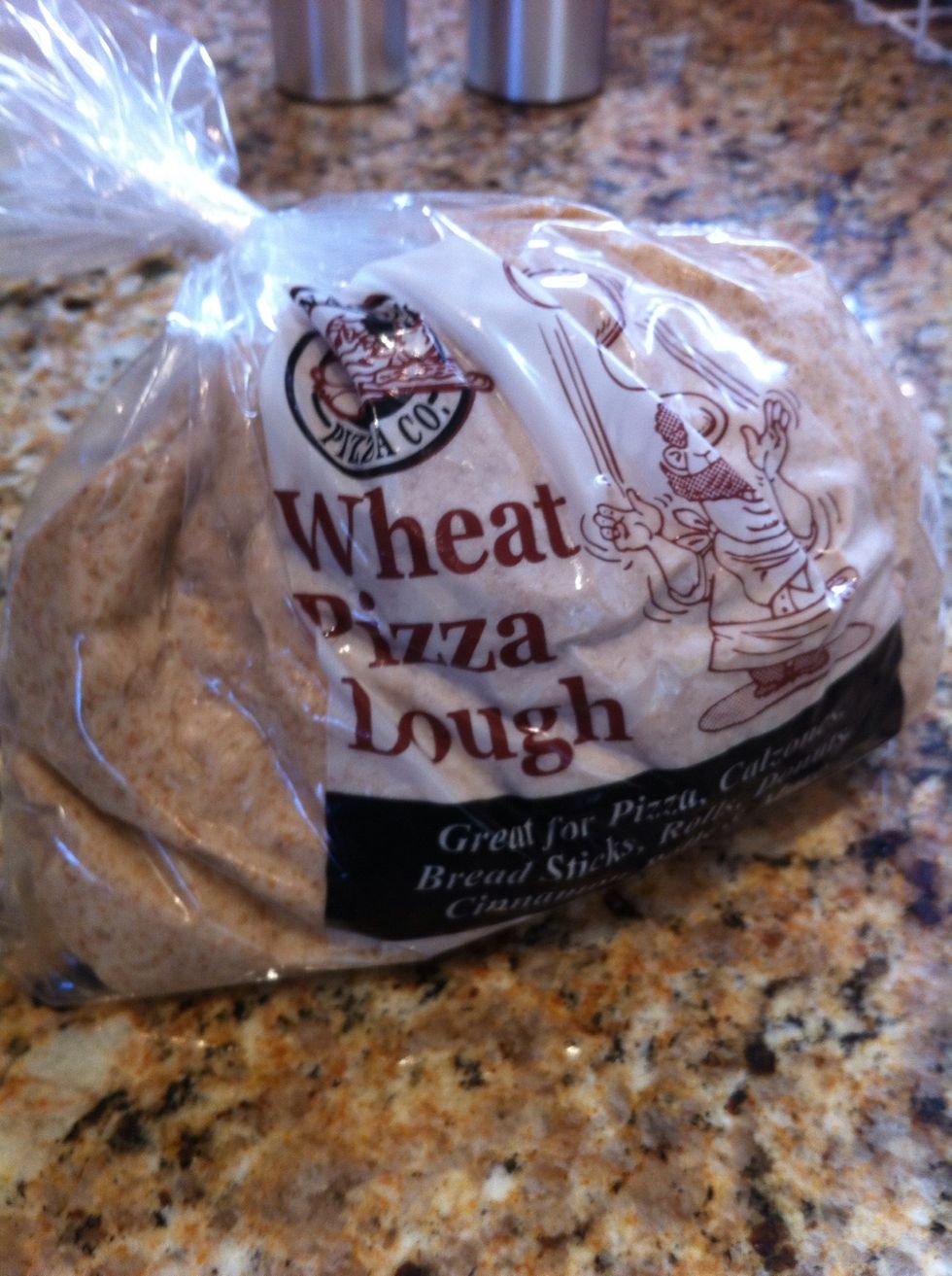 Preheat the oven to 400 degrees with top rack in the middle. Roll out dough and spread on a pizza stone or cookie sheet.