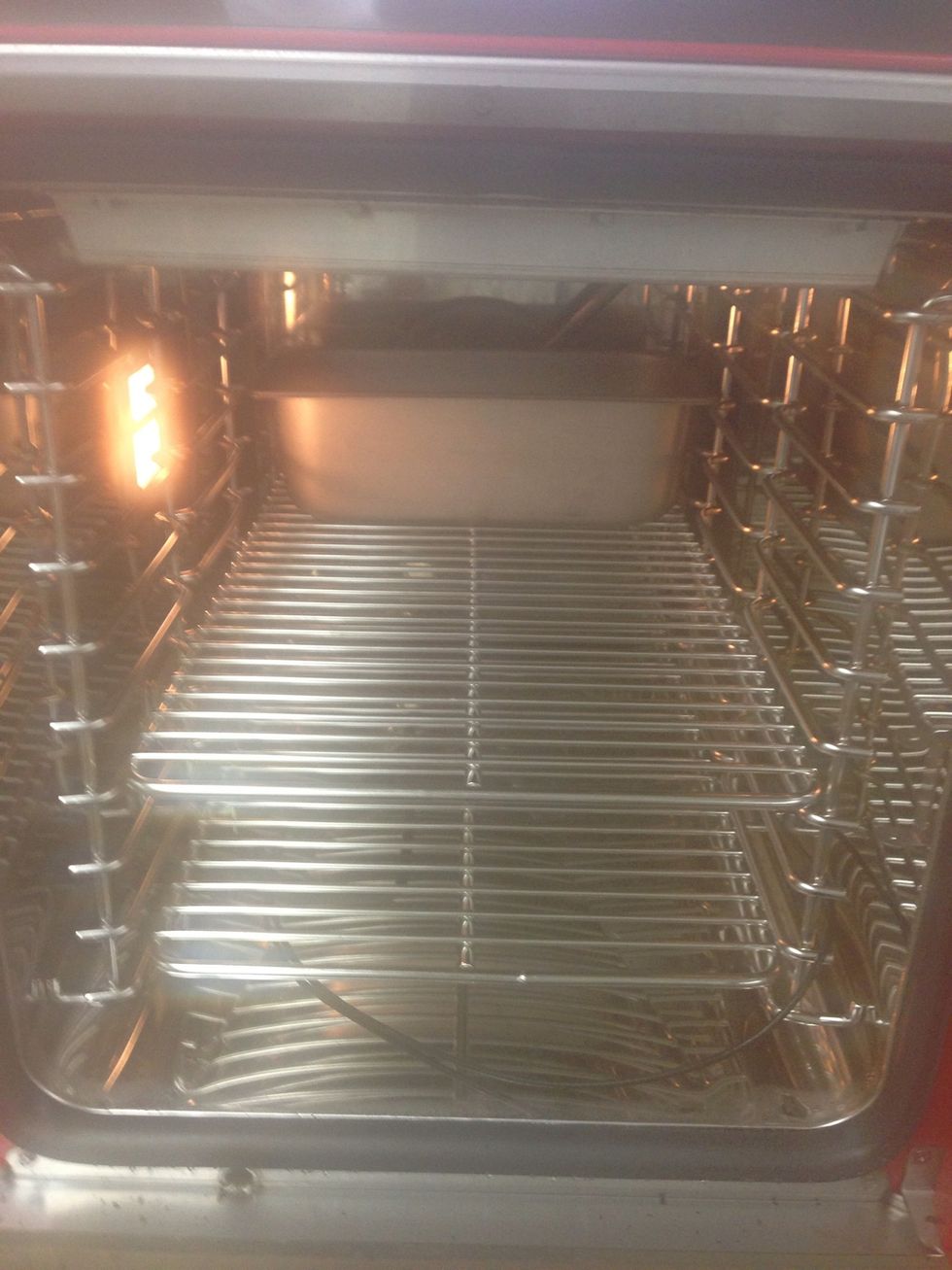 Preheat your combi to 250F (121C) in combi mode. After it is preheated, slide pan to the back of the oven.